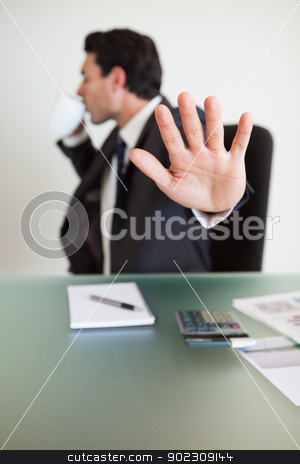 To use this stock image in your creative project, please select the size you need over to the right and click the "Add to Cart" button.
Your downloaded image will come with the Cutcaster watermark removed so don’t worry about the watermark you see on this page. Portrait of a businessman not willing to be disturbed while drin stock photo, Portrait of a businessman not willing to be disturbed while drinking coffee in his office by Wavebreak Media