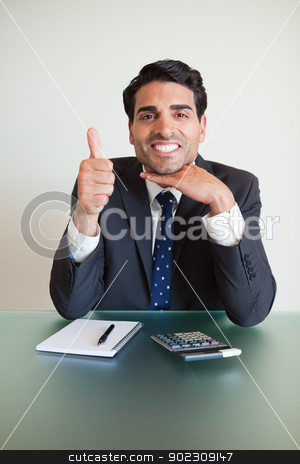 To use this stock image in your creative project, please select the size you need over to the right and click the "Add to Cart" button.
Your downloaded image will come with the Cutcaster watermark removed so don’t worry about the watermark you see on this page. Portrait of an accountant with the thumb up stock photo, Portrait of an accountant with the thumb up in his office by Wavebreak Media