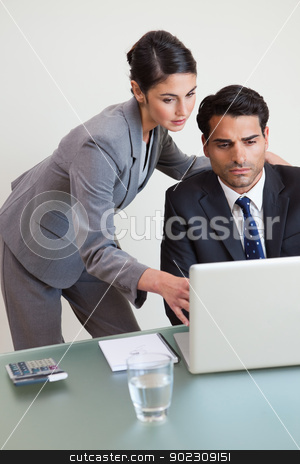 To use this stock image in your creative project, please select the size you need over to the right and click the "Add to Cart" button.
Your downloaded image will come with the Cutcaster watermark removed so don’t worry about the watermark you see on this page. Portrait of a focused business team working with a laptop stock photo, Portrait of a focused business team working with a laptop in an office by Wavebreak Media