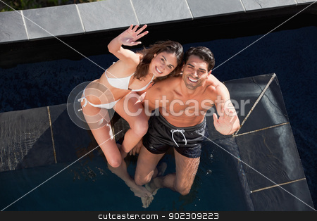 To use this stock image in your creative project, please select the size you need over to the right and click the "Add to Cart" button.
Your downloaded image will come with the Cutcaster watermark removed so don’t worry about the watermark you see on this page. Above view of a smiling couple waving at the camera stock photo, Above view of a smiling couple waving at the camera in a swimming pool by Wavebreak Media