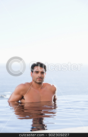 To use this stock image in your creative project, please select the size you need over to the right and click the "Add to Cart" button.
Your downloaded image will come with the Cutcaster watermark removed so don’t worry about the watermark you see on this page. Portrait of a young man relaxing stock photo, Portrait of a young man relaxing in a swimming pool by Wavebreak Media