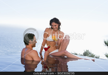 To use this stock image in your creative project, please select the size you need over to the right and click the "Add to Cart" button.
Your downloaded image will come with the Cutcaster watermark removed so don’t worry about the watermark you see on this page. Happy couple having a cocktail stock photo, Happy couple having a cocktail in a swimming pool by Wavebreak Media