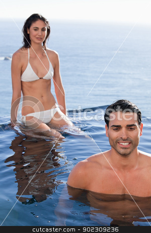 To use this stock image in your creative project, please select the size you need over to the right and click the "Add to Cart" button.
Your downloaded image will come with the Cutcaster watermark removed so don’t worry about the watermark you see on this page. Portrait of a couple relaxing stock photo, Portrait of a couple relaxing in a swimming pool by Wavebreak Media
