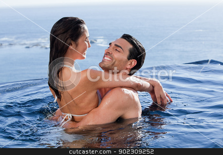 To use this stock image in your creative project, please select the size you need over to the right and click the "Add to Cart" button.
Your downloaded image will come with the Cutcaster watermark removed so don’t worry about the watermark you see on this page. Cute couple cuddling each other stock photo, Cute couple cuddling each other in a swimming pool by Wavebreak Media