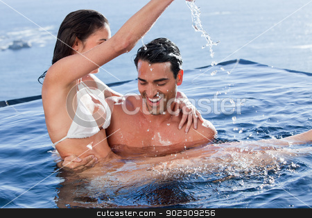 To use this stock image in your creative project, please select the size you need over to the right and click the "Add to Cart" button.
Your downloaded image will come with the Cutcaster watermark removed so don’t worry about the watermark you see on this page. Man holding his playful wife stock photo, Man holding his playful wife in a swimming pool by Wavebreak Media