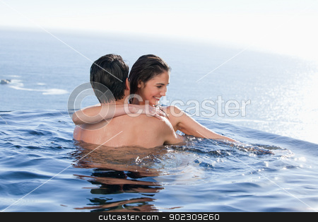 To use this stock image in your creative project, please select the size you need over to the right and click the "Add to Cart" button.
Your downloaded image will come with the Cutcaster watermark removed so don’t worry about the watermark you see on this page. Smiling couple playing together stock photo, Smiling couple playing together in a swimming pool by Wavebreak Media