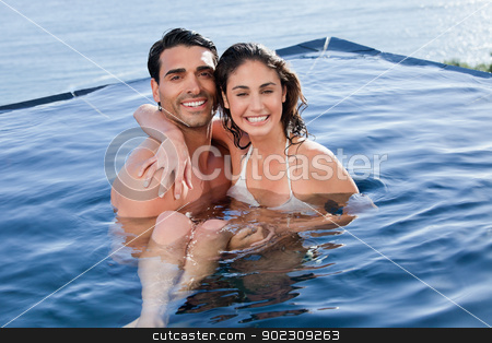To use this stock image in your creative project, please select the size you need over to the right and click the "Add to Cart" button.
Your downloaded image will come with the Cutcaster watermark removed so don’t worry about the watermark you see on this page. Young couple playing together stock photo, Young couple playing together in a swimming pool by Wavebreak Media