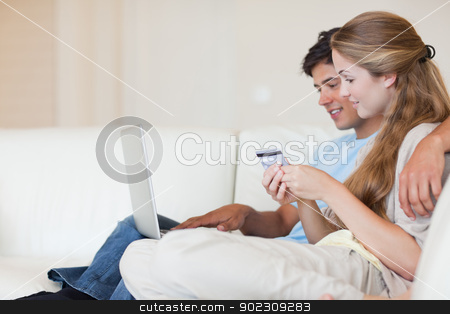 To use this stock image in your creative project, please select the size you need over to the right and click the "Add to Cart" button.
Your downloaded image will come with the Cutcaster watermark removed so don’t worry about the watermark you see on this page. Couple shopping online stock photo, Couple shopping online in their living room by Wavebreak Media
