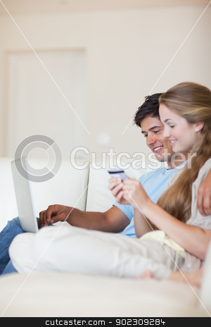 To use this stock image in your creative project, please select the size you need over to the right and click the "Add to Cart" button.
Your downloaded image will come with the Cutcaster watermark removed so don’t worry about the watermark you see on this page. Portrait of a couple shopping online stock photo, Portrait of a couple shopping online in their living room by Wavebreak Media