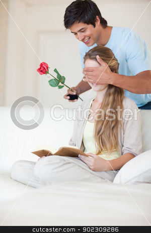 To use this stock image in your creative project, please select the size you need over to the right and click the "Add to Cart" button.
Your downloaded image will come with the Cutcaster watermark removed so don’t worry about the watermark you see on this page. Portrait of a man offering a rose to his girlfriend stock photo, Portrait of a man offering a rose to his girlfriend while she is reading by Wavebreak Media
