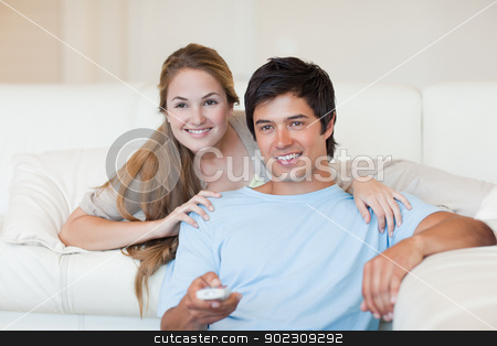 To use this stock image in your creative project, please select the size you need over to the right and click the "Add to Cart" button.
Your downloaded image will come with the Cutcaster watermark removed so don’t worry about the watermark you see on this page. Happy couple watching television stock photo, Happy couple watching television in their living room by Wavebreak Media