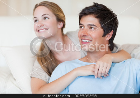 To use this stock image in your creative project, please select the size you need over to the right and click the "Add to Cart" button.
Your downloaded image will come with the Cutcaster watermark removed so don’t worry about the watermark you see on this page. Close up of a smiling couple posing stock photo, Close up of a smiling couple posing in their living room by Wavebreak Media