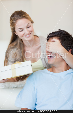To use this stock image in your creative project, please select the size you need over to the right and click the "Add to Cart" button.
Your downloaded image will come with the Cutcaster watermark removed so don’t worry about the watermark you see on this page. Portrait of a woman offering a present stock photo, Portrait of a woman offering a present to her boyfriend by Wavebreak Media