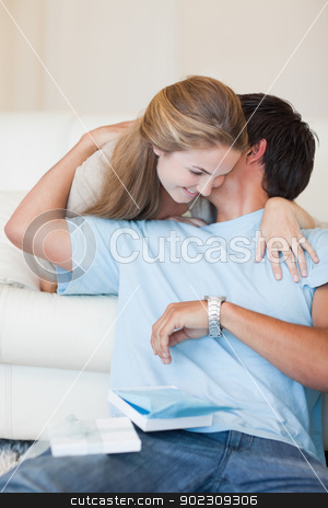 To use this stock image in your creative project, please select the size you need over to the right and click the "Add to Cart" button.
Your downloaded image will come with the Cutcaster watermark removed so don’t worry about the watermark you see on this page. Portrait of a woman offering a watch to her boyfriend stock photo, Portrait of a woman offering a watch to her boyfriend in their living room by Wavebreak Media