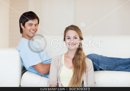 To use this stock image in your creative project, please select the size you need over to the right and click the "Add to Cart" button.
Your downloaded image will come with the Cutcaster watermark removed so don’t worry about the watermark you see on this page. Couple smiling at the camera stock photo, Couple smiling at the camera in their living room by Wavebreak Media