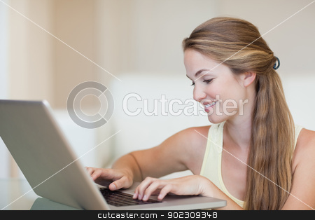 To use this stock image in your creative project, please select the size you need over to the right and click the "Add to Cart" button.
Your downloaded image will come with the Cutcaster watermark removed so don’t worry about the watermark you see on this page. Woman using a notebook stock photo, Woman using a notebook in her living room by Wavebreak Media