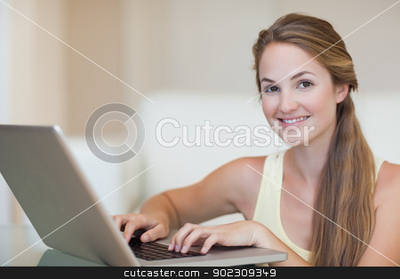 To use this stock image in your creative project, please select the size you need over to the right and click the "Add to Cart" button.
Your downloaded image will come with the Cutcaster watermark removed so don’t worry about the watermark you see on this page. Young woman using a notebook stock photo, Young woman using a notebook in her living room by Wavebreak Media