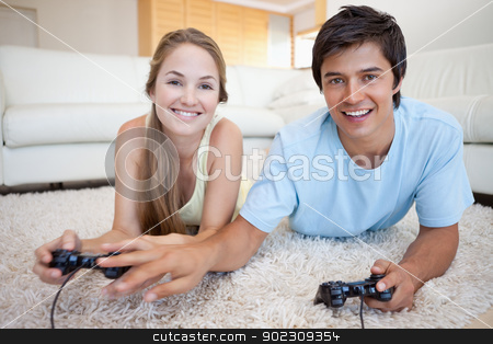 To use this stock image in your creative project, please select the size you need over to the right and click the "Add to Cart" button.
Your downloaded image will come with the Cutcaster watermark removed so don’t worry about the watermark you see on this page. Young couple playing video games stock photo, Young couple playing video games in their living room by Wavebreak Media