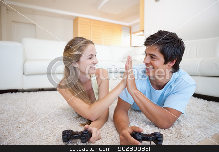 To use this stock image in your creative project, please select the size you need over to the right and click the "Add to Cart" button.
Your downloaded image will come with the Cutcaster watermark removed so don’t worry about the watermark you see on this page. Playful cute couple playing video games stock photo, Playful cute couple playing video games in their living room by Wavebreak Media
