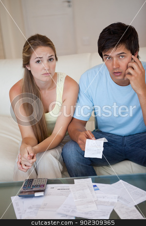 To use this stock image in your creative project, please select the size you need over to the right and click the "Add to Cart" button.
Your downloaded image will come with the Cutcaster watermark removed so don’t worry about the watermark you see on this page. Portrait of a worried couple looking at their receipts stock photo, Portrait of a worried couple looking at their receipts in their living room by Wavebreak Media