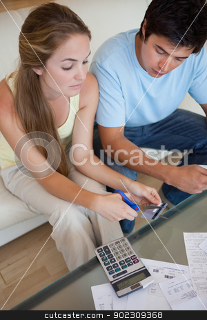 To use this stock image in your creative project, please select the size you need over to the right and click the "Add to Cart" button.
Your downloaded image will come with the Cutcaster watermark removed so don’t worry about the watermark you see on this page. Portrait of a sad young couple looking at their bills stock photo, Portrait of a sad young couple looking at their bills in their living room by Wavebreak Media