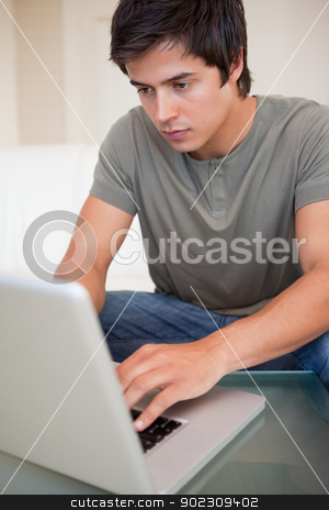 To use this stock image in your creative project, please select the size you need over to the right and click the "Add to Cart" button.
Your downloaded image will come with the Cutcaster watermark removed so don’t worry about the watermark you see on this page. Portrait of a man using a laptop stock photo, Portrait of a man using a laptop in his living room by Wavebreak Media