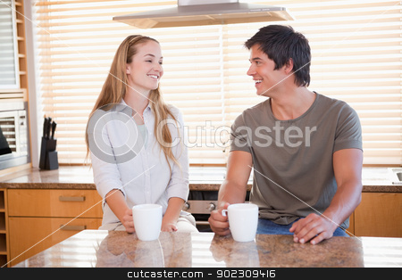 To use this stock image in your creative project, please select the size you need over to the right and click the "Add to Cart" button.
Your downloaded image will come with the Cutcaster watermark removed so don’t worry about the watermark you see on this page. Young couple having a cup of coffee stock photo, Young couple having a cup of coffee in their kitchen by Wavebreak Media