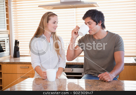 To use this stock image in your creative project, please select the size you need over to the right and click the "Add to Cart" button.
Your downloaded image will come with the Cutcaster watermark removed so don’t worry about the watermark you see on this page. Smiling couple having a cup of coffee stock photo, Smiling couple having a cup of coffee in their kitchen by Wavebreak Media