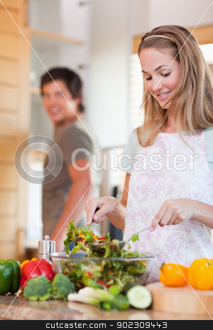 To use this stock image in your creative project, please select the size you need over to the right and click the "Add to Cart" button.
Your downloaded image will come with the Cutcaster watermark removed so don’t worry about the watermark you see on this page. Portrait of a lovely couple making a salad stock photo, Portrait of a lovely couple making a salad in their kitchen by Wavebreak Media