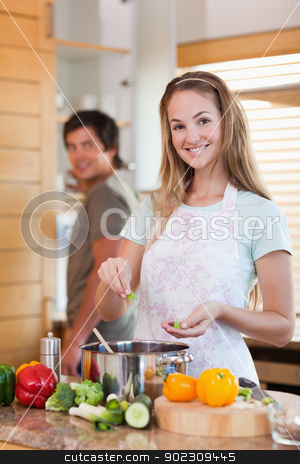 To use this stock image in your creative project, please select the size you need over to the right and click the "Add to Cart" button.
Your downloaded image will come with the Cutcaster watermark removed so don’t worry about the watermark you see on this page. Portrait of a smiling couple cooking stock photo, Portrait of a smiling couple cooking in their kitchen by Wavebreak Media