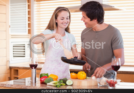 To use this stock image in your creative project, please select the size you need over to the right and click the "Add to Cart" button.
Your downloaded image will come with the Cutcaster watermark removed so don’t worry about the watermark you see on this page. Couple cooking dinner stock photo, Couple cooking dinner in their kitchen by Wavebreak Media