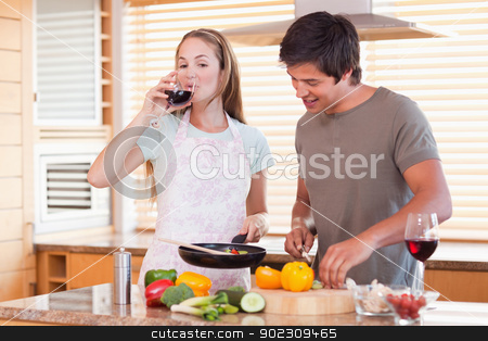 To use this stock image in your creative project, please select the size you need over to the right and click the "Add to Cart" button.
Your downloaded image will come with the Cutcaster watermark removed so don’t worry about the watermark you see on this page. Couple cooking dinner while drinking wine stock photo, Couple cooking dinner while drinking wine in their kitchen by Wavebreak Media