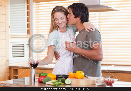 To use this stock image in your creative project, please select the size you need over to the right and click the "Add to Cart" button.
Your downloaded image will come with the Cutcaster watermark removed so don’t worry about the watermark you see on this page. Lovely couple drinking wine while kissing stock photo, Lovely couple drinking wine while kissing in their kitchen by Wavebreak Media