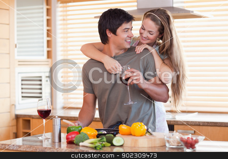 To use this stock image in your creative project, please select the size you need over to the right and click the "Add to Cart" button.
Your downloaded image will come with the Cutcaster watermark removed so don’t worry about the watermark you see on this page. Lovely couple drinking wine while hugging stock photo, Lovely couple drinking wine while hugging in their kitchen by Wavebreak Media