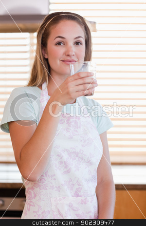 To use this stock image in your creative project, please select the size you need over to the right and click the "Add to Cart" button.
Your downloaded image will come with the Cutcaster watermark removed so don’t worry about the watermark you see on this page. Portrait of a woman drinking milk stock photo, Portrait of a woman drinking milk in her kitchen by Wavebreak Media