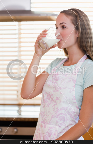 To use this stock image in your creative project, please select the size you need over to the right and click the "Add to Cart" button.
Your downloaded image will come with the Cutcaster watermark removed so don’t worry about the watermark you see on this page. Portrait of a gorgeous woman drinking milk stock photo, Portrait of a gorgeous woman drinking milk in her kitchen by Wavebreak Media