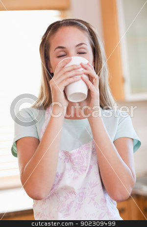To use this stock image in your creative project, please select the size you need over to the right and click the "Add to Cart" button.
Your downloaded image will come with the Cutcaster watermark removed so don’t worry about the watermark you see on this page. Portrait of a calm woman drinking a cup of tea stock photo, Portrait of a calm woman drinking a cup of tea in her kitchen by Wavebreak Media