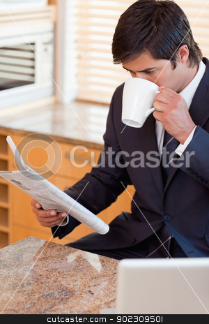 To use this stock image in your creative project, please select the size you need over to the right and click the "Add to Cart" button.
Your downloaded image will come with the Cutcaster watermark removed so don’t worry about the watermark you see on this page. Portrait of a businessman drinking coffee while reading the news stock photo, Portrait of a businessman drinking coffee while reading the news in his kitchen by Wavebreak Media