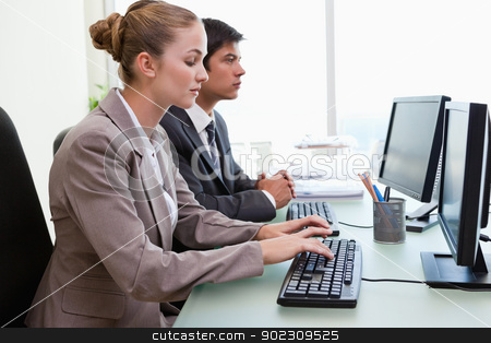 To use this stock image in your creative project, please select the size you need over to the right and click the "Add to Cart" button.
Your downloaded image will come with the Cutcaster watermark removed so don’t worry about the watermark you see on this page. Business people working with computers stock photo, Business people working with computers in an office by Wavebreak Media