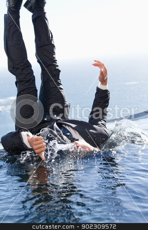 To use this stock image in your creative project, please select the size you need over to the right and click the "Add to Cart" button.
Your downloaded image will come with the Cutcaster watermark removed so don’t worry about the watermark you see on this page. Portrait of a cheerful businessman falling into water stock photo, Portrait of a cheerful businessman falling into water with the thumb up by Wavebreak Media