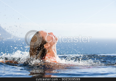 To use this stock image in your creative project, please select the size you need over to the right and click the "Add to Cart" button.
Your downloaded image will come with the Cutcaster watermark removed so don’t worry about the watermark you see on this page. Gorgeous woman raising her head out of the water stock photo, Gorgeous woman raising her head out of the water in a swimming pool by Wavebreak Media
