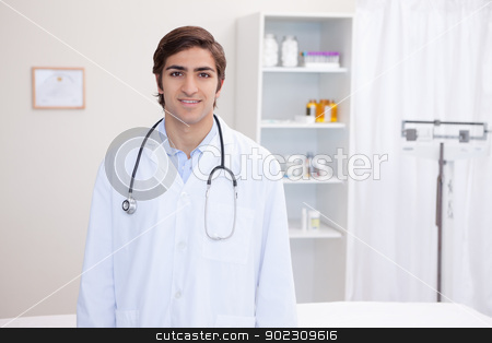 To use this stock image in your creative project, please select the size you need over to the right and click the "Add to Cart" button.
Your downloaded image will come with the Cutcaster watermark removed so don’t worry about the watermark you see on this page. Smiling male doctor standing stock photo, Smiling young male doctor standing by Wavebreak Media