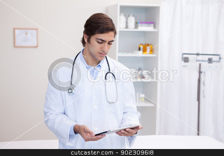 To use this stock image in your creative project, please select the size you need over to the right and click the "Add to Cart" button.
Your downloaded image will come with the Cutcaster watermark removed so don’t worry about the watermark you see on this page. Male doctor working on tablet stock photo, Young male doctor working on tablet by Wavebreak Media