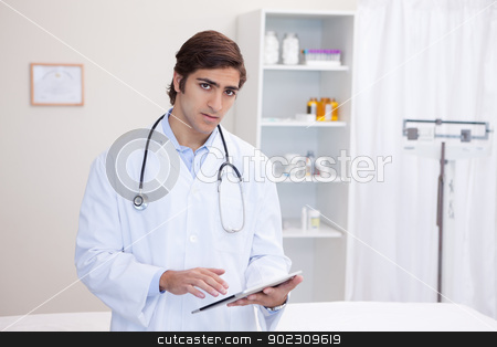 To use this stock image in your creative project, please select the size you need over to the right and click the "Add to Cart" button.
Your downloaded image will come with the Cutcaster watermark removed so don’t worry about the watermark you see on this page. Male doctor using tablet stock photo, Young male doctor using tablet by Wavebreak Media