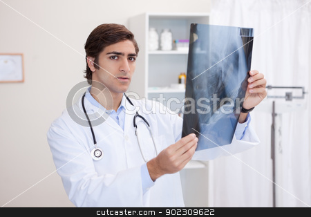 To use this stock image in your creative project, please select the size you need over to the right and click the "Add to Cart" button.
Your downloaded image will come with the Cutcaster watermark removed so don’t worry about the watermark you see on this page. Male doctor analyzing x-ray stock photo, Young male doctor analyzing x-ray by Wavebreak Media