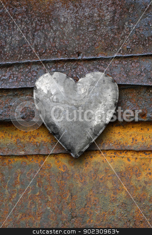 To use this stock image in your creative project, please select the size you need over to the right and click the "Add to Cart" button.
Your downloaded image will come with the Cutcaster watermark removed so don’t worry about the watermark you see on this page. Metal heart on rusty background stock photo, Photo of metal heart on a rusting iron background. by © Ron Sumners