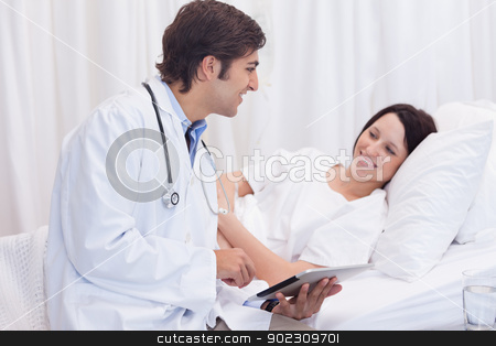 To use this stock image in your creative project, please select the size you need over to the right and click the "Add to Cart" button.
Your downloaded image will come with the Cutcaster watermark removed so don’t worry about the watermark you see on this page. Doctor telling his patient the good news stock photo, Young doctor telling his patient the good news by Wavebreak Media