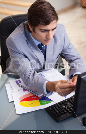 To use this stock image in your creative project, please select the size you need over to the right and click the "Add to Cart" button.
Your downloaded image will come with the Cutcaster watermark removed so don’t worry about the watermark you see on this page. Businessman analyzing statistics stock photo, Young businessman analyzing statistics by Wavebreak Media