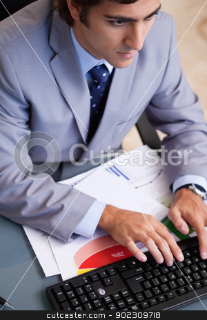 To use this stock image in your creative project, please select the size you need over to the right and click the "Add to Cart" button.
Your downloaded image will come with the Cutcaster watermark removed so don’t worry about the watermark you see on this page. Above view of businessman typing stock photo, Above view of young businessman typing by Wavebreak Media