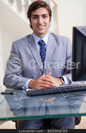 To use this stock image in your creative project, please select the size you need over to the right and click the "Add to Cart" button.
Your downloaded image will come with the Cutcaster watermark removed so don’t worry about the watermark you see on this page. Smiling businessman sitting at his computer stock photo, Smiling young businessman sitting at his computer by Wavebreak Media
